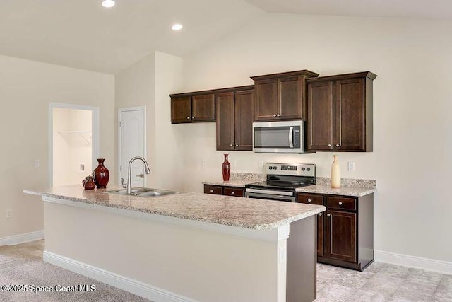 1581 San Filippo Dr SE, Palm Bay, FL 32909 - kitchen with appliances with stainless steel finishes, vaulted ceiling, baseboards, a sink, and dark brown cabinets