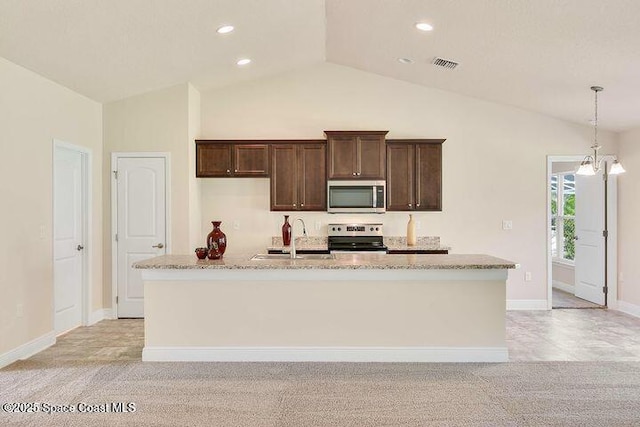 1581 San Filippo Dr SE, Palm Bay, FL 32909 - kitchen with appliances with stainless steel finishes, a sink, dark brown cabinets, vaulted ceiling, and light colored carpet