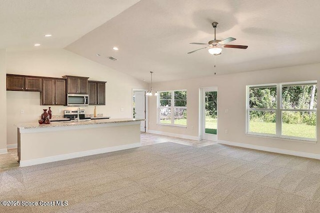 1581 San Filippo Dr SE, Palm Bay, FL 32909 - kitchen featuring stainless steel appliances, lofted ceiling, ceiling fan, light carpet, and dark brown cabinetry