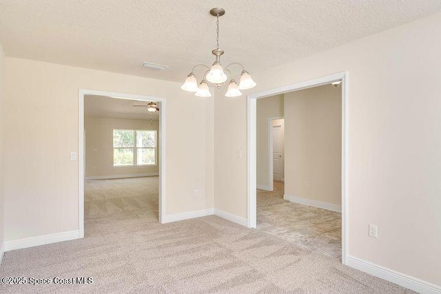 1581 San Filippo Dr SE, Palm Bay, FL 32909 - empty room with a chandelier, a textured ceiling, light colored carpet, ceiling fan, and baseboards