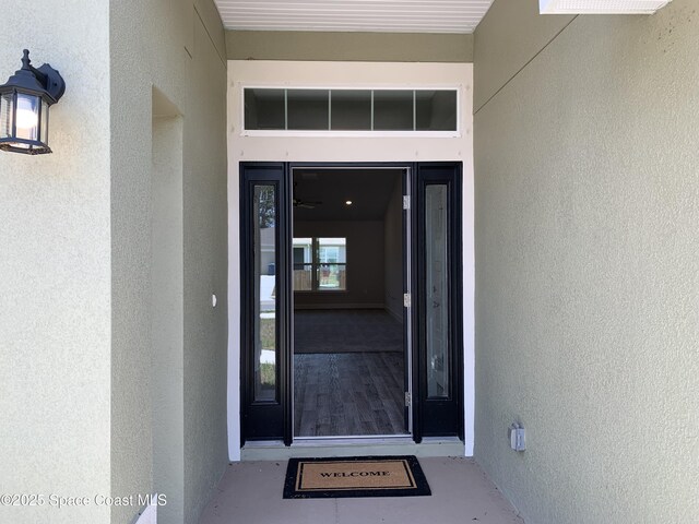 1581 San Filippo Dr SE, Palm Bay, FL 32909 - doorway to property featuring stucco siding