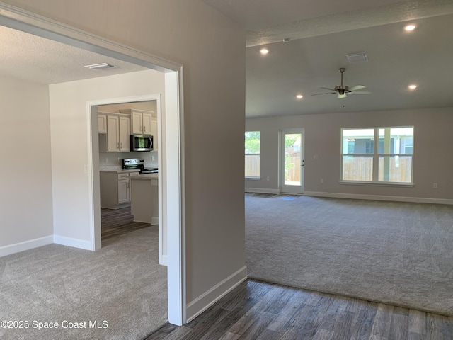1581 San Filippo Dr SE, Palm Bay, FL 32909 - carpeted empty room featuring a ceiling fan and recessed lighting