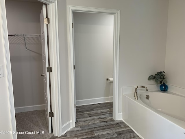 1581 San Filippo Dr SE, Palm Bay, FL 32909 - full bath with a bath, a spacious closet, and wood finished floors