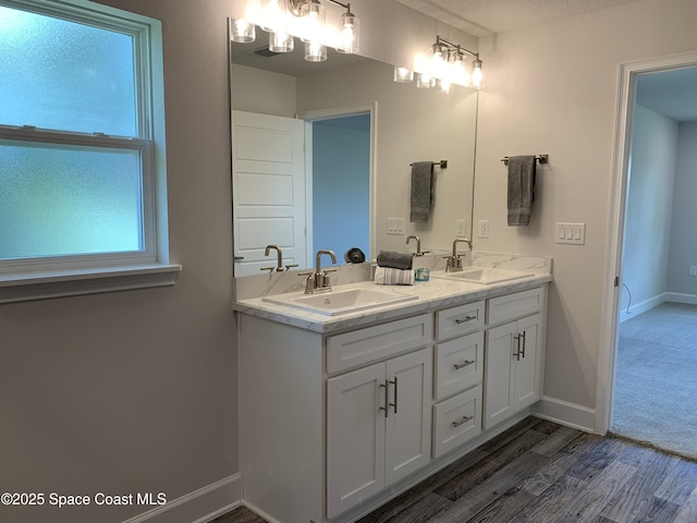 1581 San Filippo Dr SE, Palm Bay, FL 32909 - full bathroom with wood finished floors and double vanity
