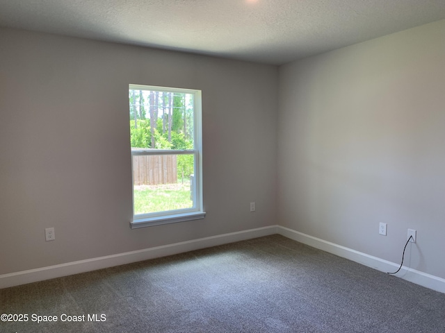 1581 San Filippo Dr SE, Palm Bay, FL 32909 - carpeted empty room featuring baseboards