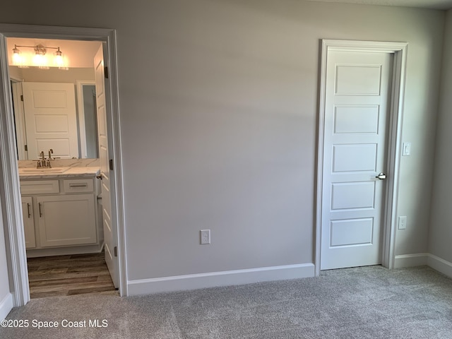 1581 San Filippo Dr SE, Palm Bay, FL 32909 - unfurnished bedroom featuring carpet flooring and baseboards