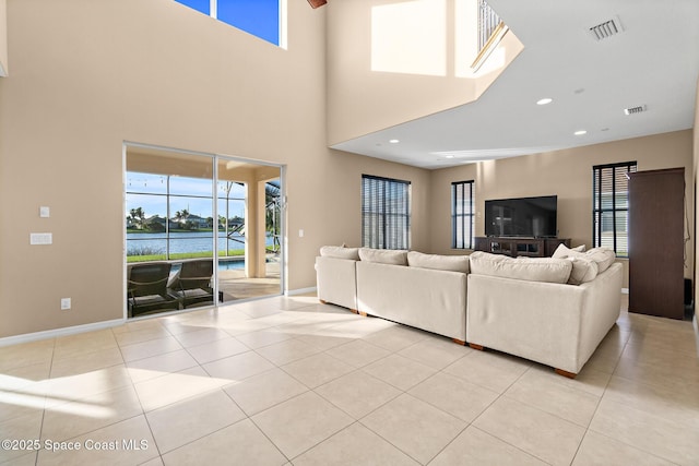 living room featuring recessed lighting, visible vents, baseboards, and light tile patterned floors