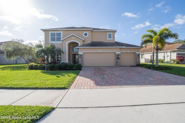 view of front of home with stone siding, a front lawn, decorative driveway, and stucco siding