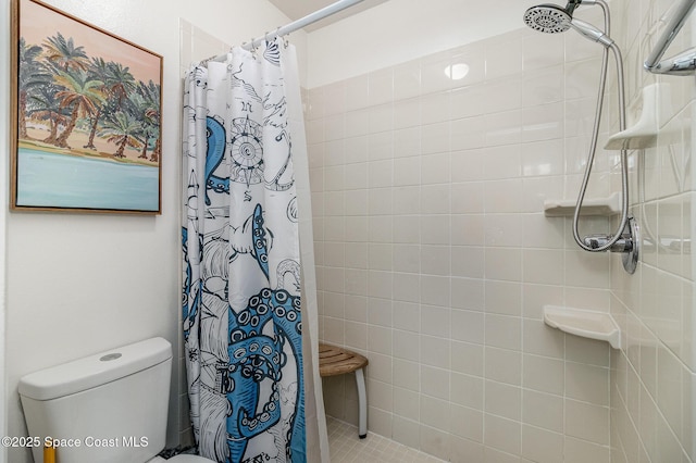 full bathroom with toilet and tiled shower