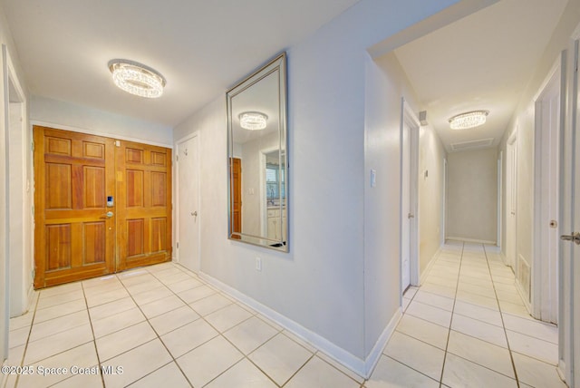 entrance foyer featuring light tile patterned floors