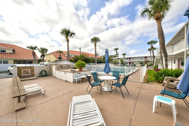 view of patio featuring a community pool