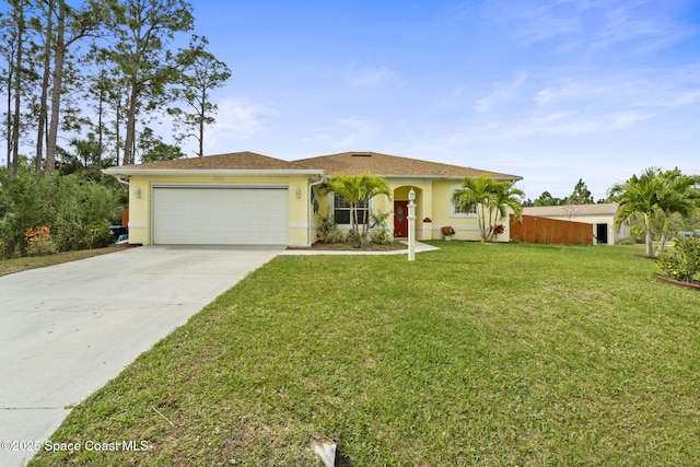 view of front of property featuring a garage and a front yard