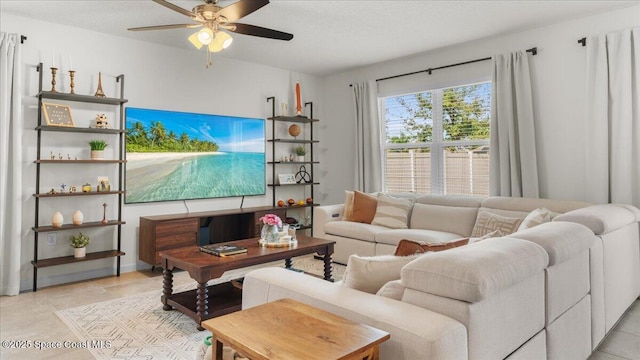 tiled living room featuring ceiling fan and a textured ceiling