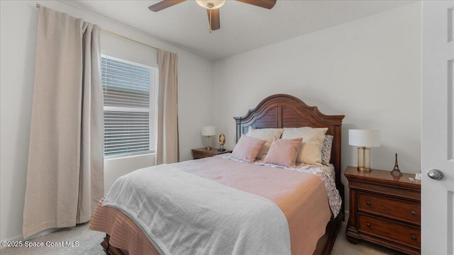 bedroom with light colored carpet and ceiling fan