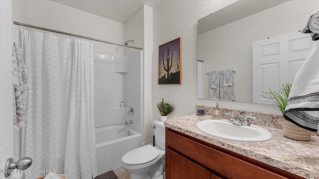 full bathroom with vanity, toilet, shower / tub combo, and a textured ceiling