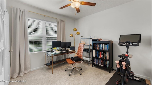 carpeted office with ceiling fan