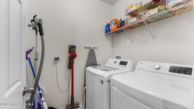 clothes washing area featuring washing machine and dryer