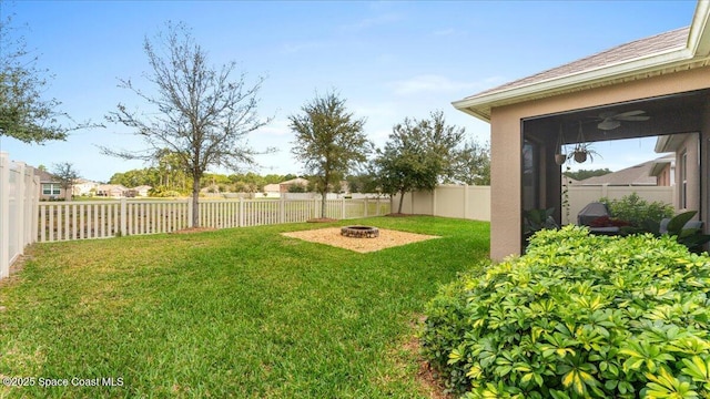 view of yard featuring a fire pit