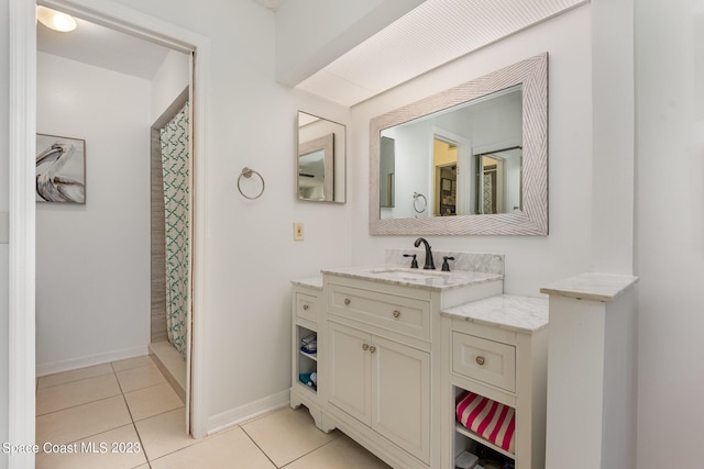 bathroom featuring a shower with shower curtain, vanity, and tile patterned floors