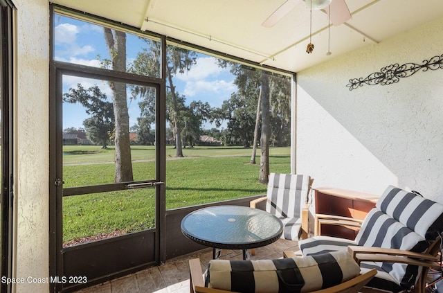 sunroom / solarium with ceiling fan