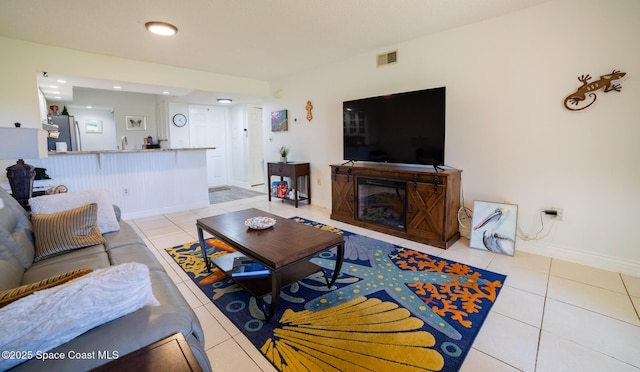 tiled living room featuring sink