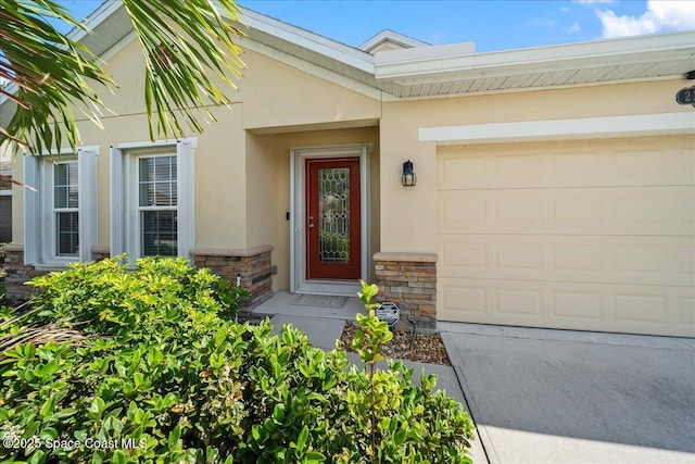 doorway to property featuring a garage