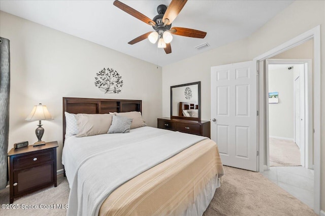 bedroom with light carpet and ceiling fan