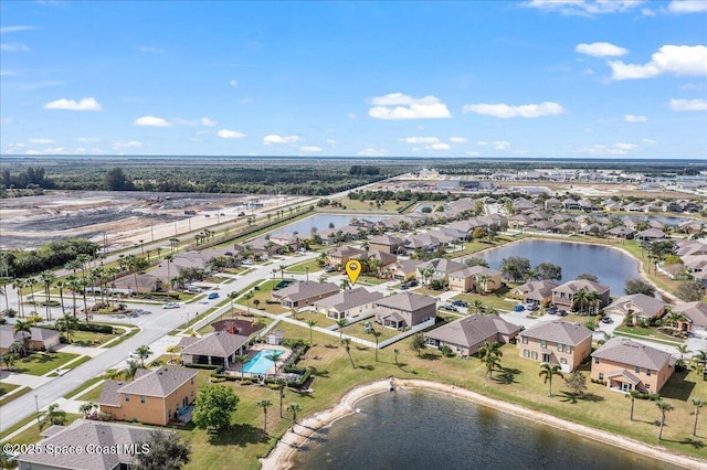 drone / aerial view with a water view