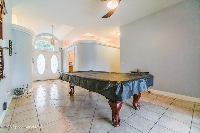 rec room with french doors, light tile patterned floors, lofted ceiling, pool table, and baseboards