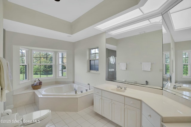 bathroom with vanity, tile patterned flooring, toilet, and a bathing tub