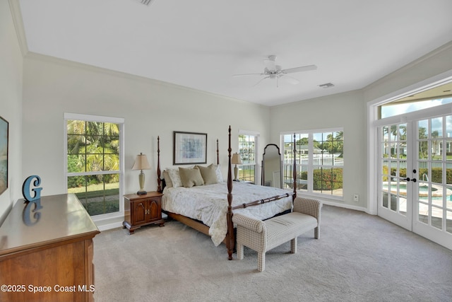 bedroom with french doors, crown molding, access to outside, ceiling fan, and light colored carpet