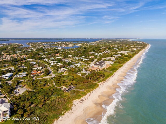 aerial view featuring a water view and a beach view