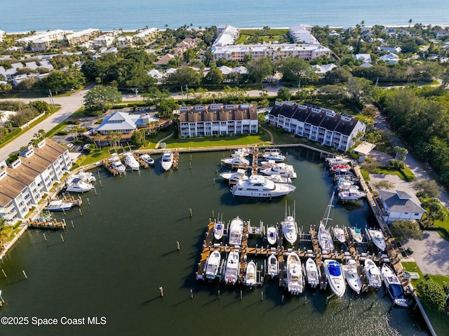 birds eye view of property featuring a water view