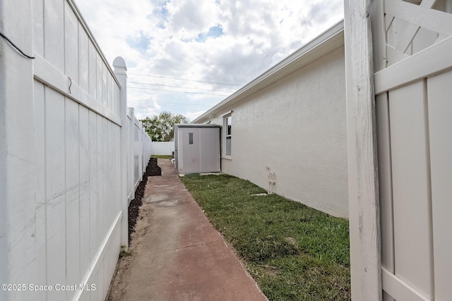 view of property exterior with fence and stucco siding