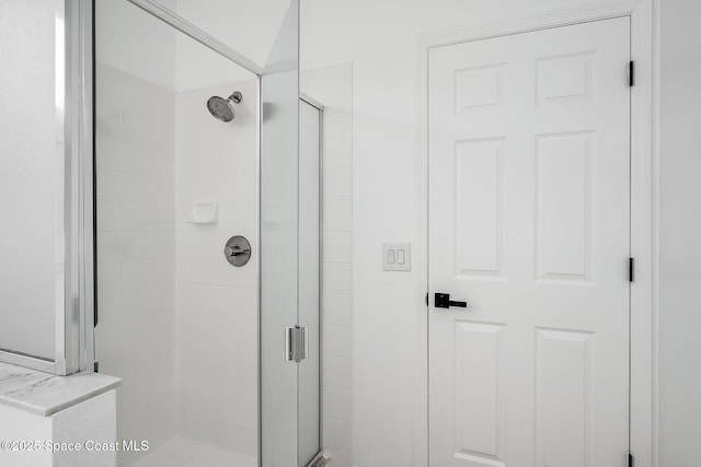 full bathroom featuring a stall shower