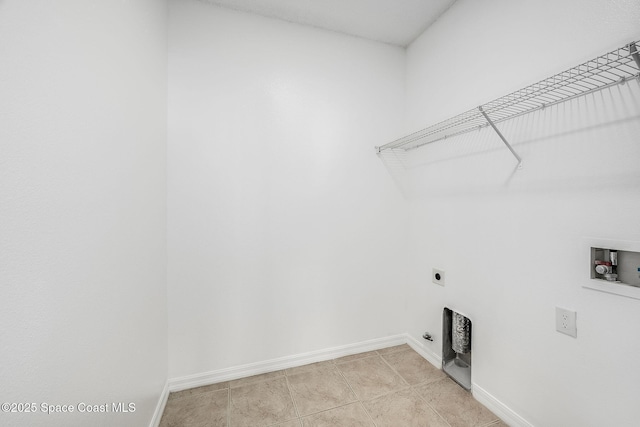 clothes washing area featuring washer hookup, laundry area, hookup for an electric dryer, and baseboards