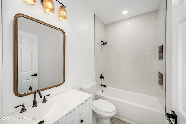 bathroom with shower / tub combination, vanity, and toilet