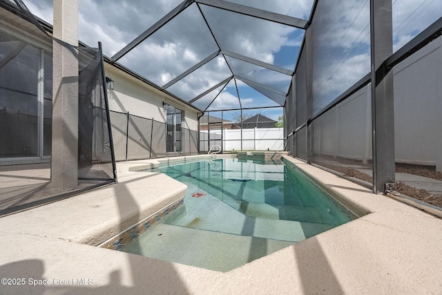 view of swimming pool featuring fence, a fenced in pool, and a patio