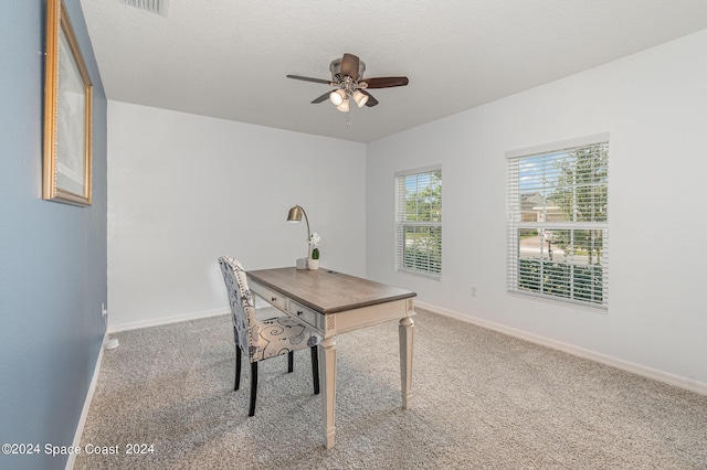 home office with ceiling fan, a textured ceiling, and carpet flooring