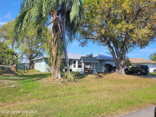 ranch-style home with a front yard