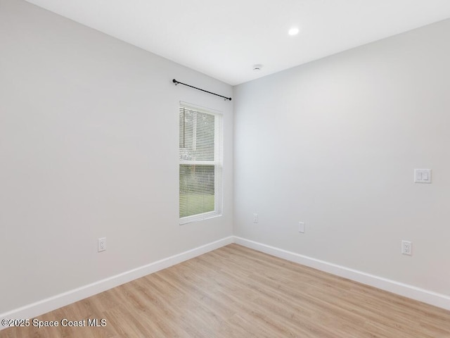 spare room featuring light wood-type flooring