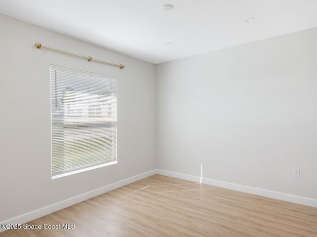 unfurnished room featuring light wood-type flooring