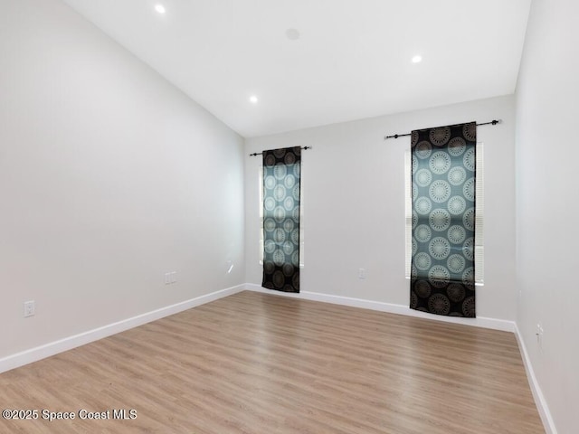 spare room with light wood-type flooring