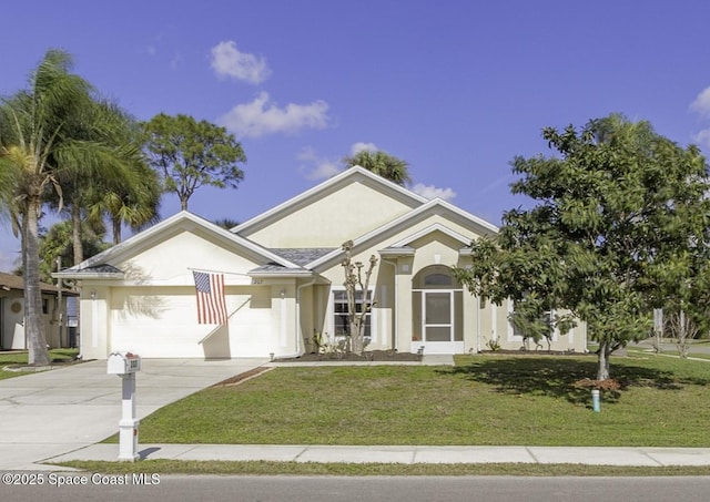 view of front of property featuring a garage and a front lawn