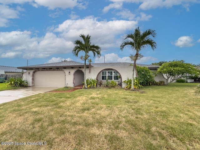 single story home featuring a garage and a front yard