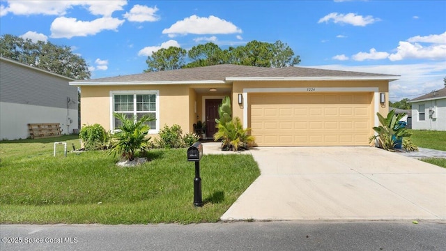 view of front of property featuring a garage and a front lawn