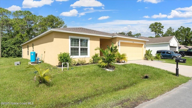 view of front of home with a garage and a front yard