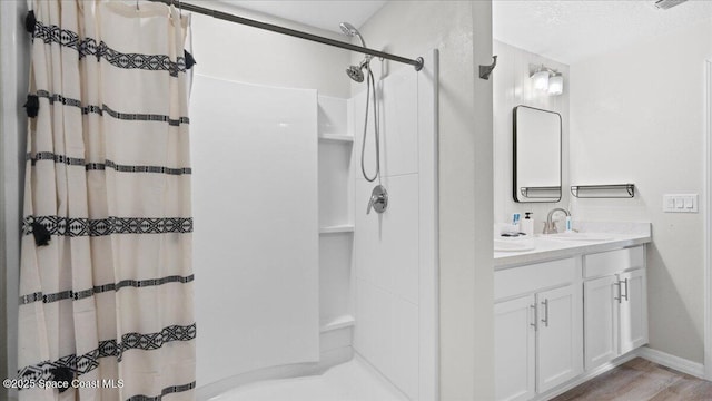 bathroom with vanity and walk in shower