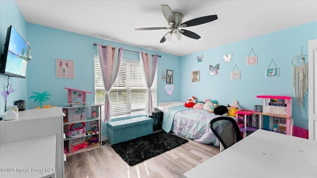 bedroom with ceiling fan and hardwood / wood-style floors