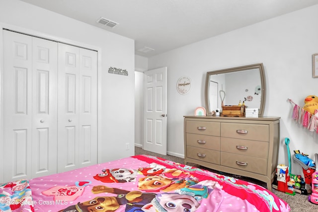 carpeted bedroom featuring a closet